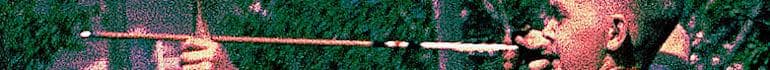 Long narrow stripe with my face at right sighting along an archery arrow toward the left.